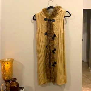 Long fur lined sleeveless vest with hood